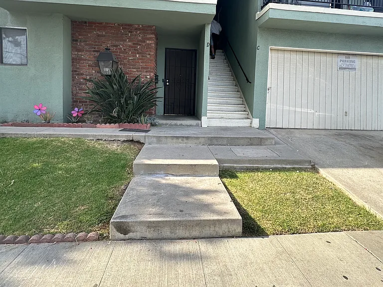 Welcome home you're a ground unit garage is on the right living area is on the left with a bedroom off the garage good size bedrooms garage is yours with a driveway that fits small cars