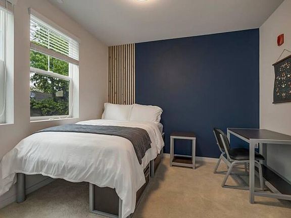 Sleep well! This room has a full size bed with a desk and chair.