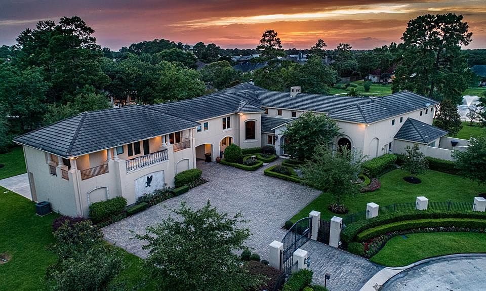 Stunning custom home on private lake on almost 2 acres in Lakes of Sterling Gate.