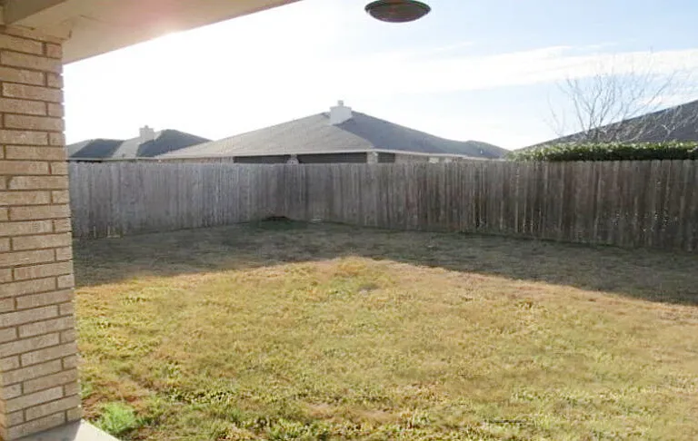Safe fenced in backyard for children and pets.