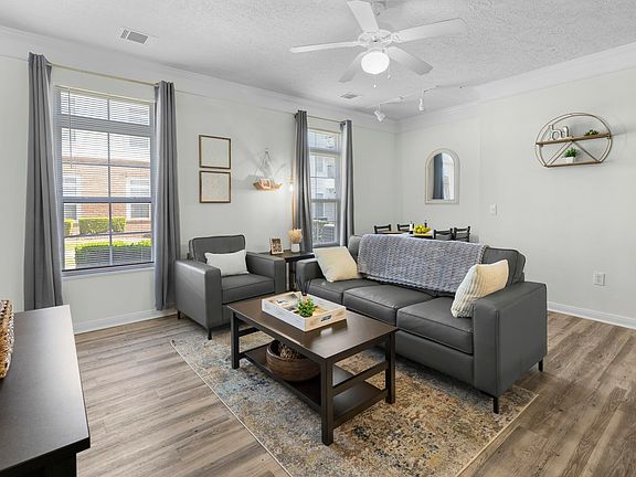Relax in your modern, fully furnished living room at The Quarters, off-campus housing near UL Lafayette.