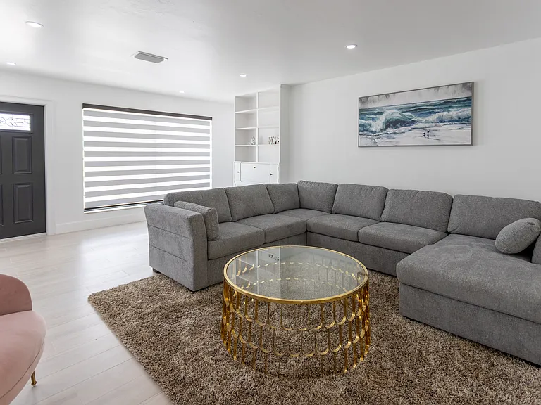 living room with main front door in the background