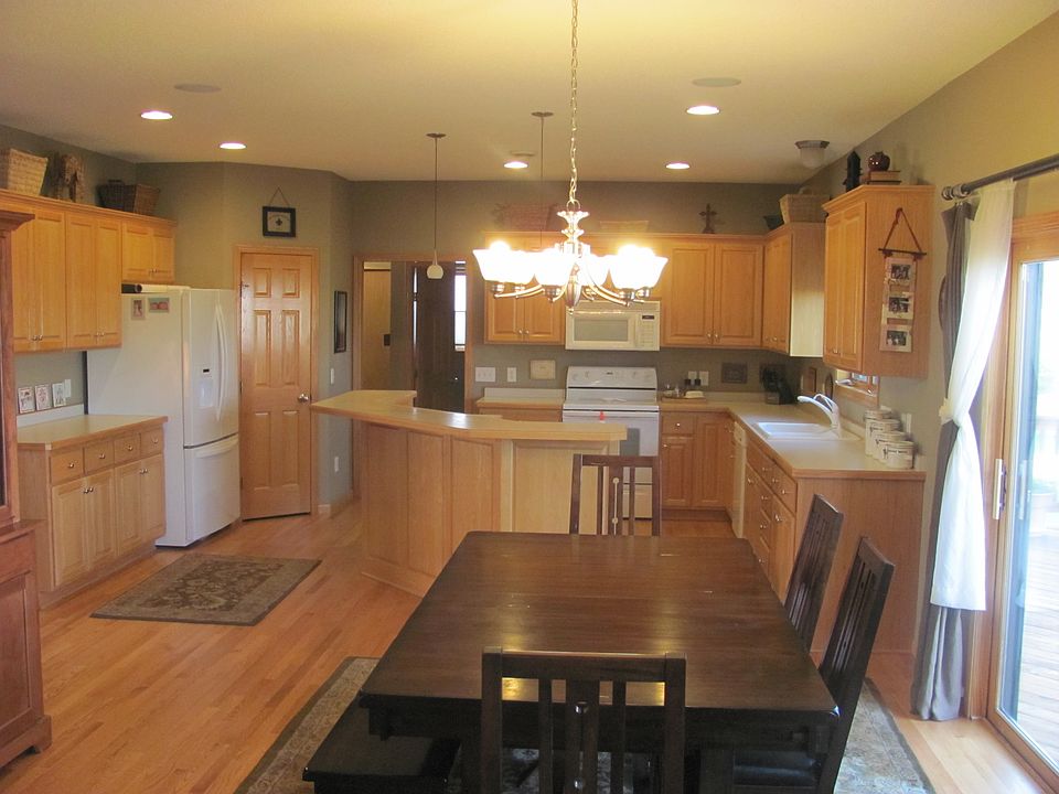 Open Kitchen with center island and hardwood floors