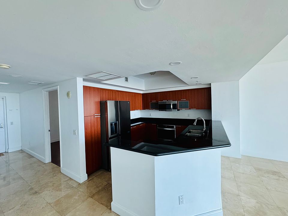 Open kitchen with stainless steel appliances and extra cabinets space