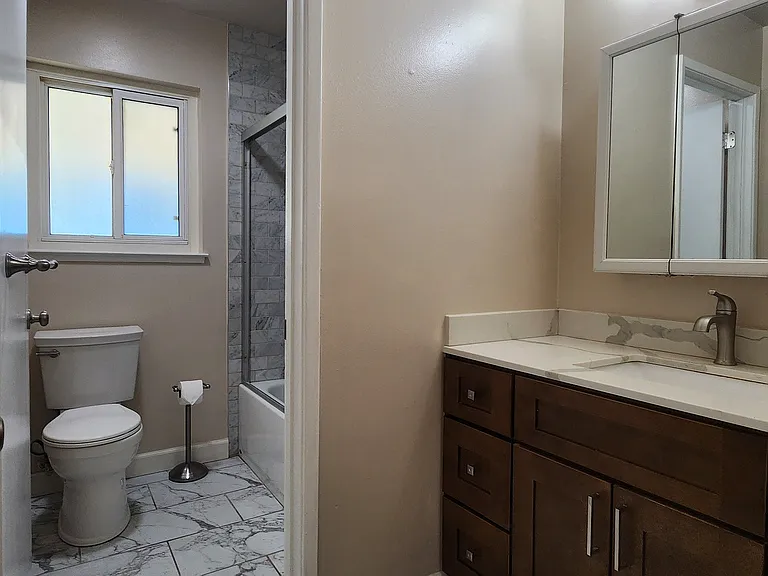 Bathroom with marble floor and shower