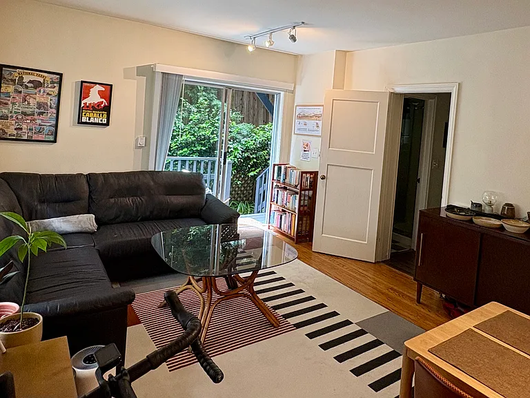 Living room leads to private back deck