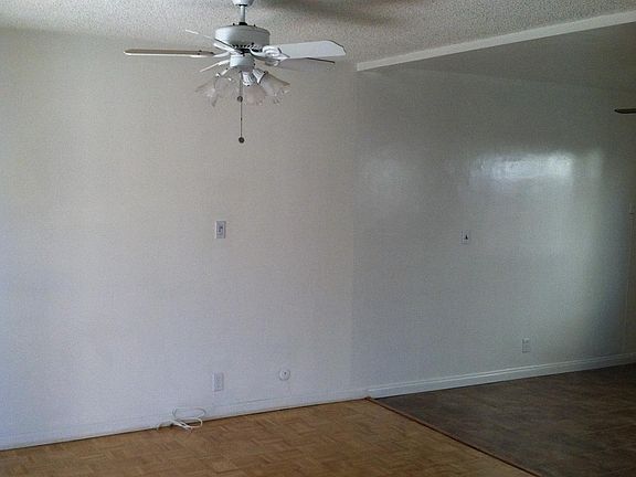 dining room with ceiling fan - hardwood floors have been replaced with new wood laminate