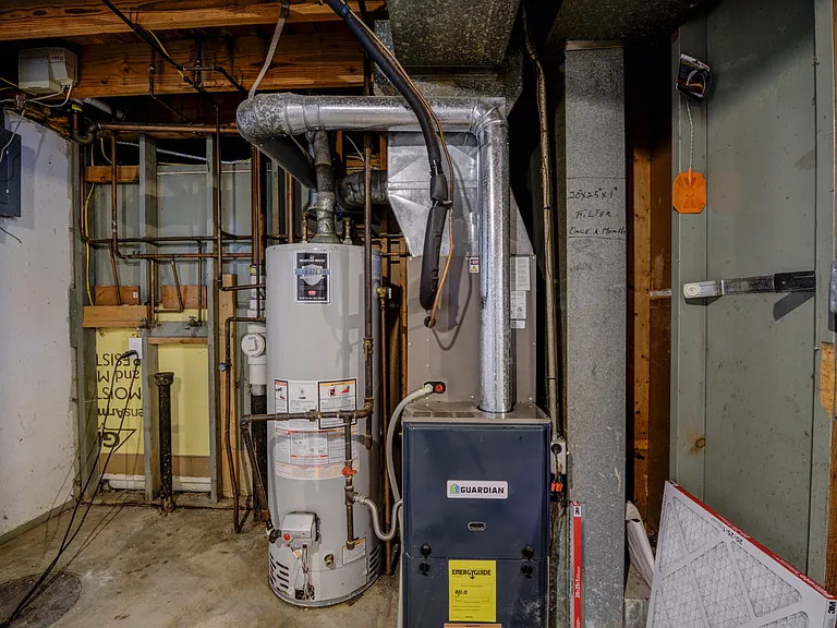 Water heater and Furnace area with Laundry hook-ups to the left.