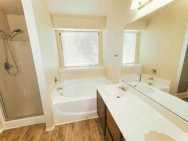 The private master bath offers the best of both worlds with a dedicated garden tub and a standalone shower enclosure