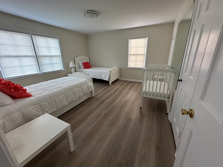Bedroom With 2 Twin Beds, 1 Trundle, and 1 Crib