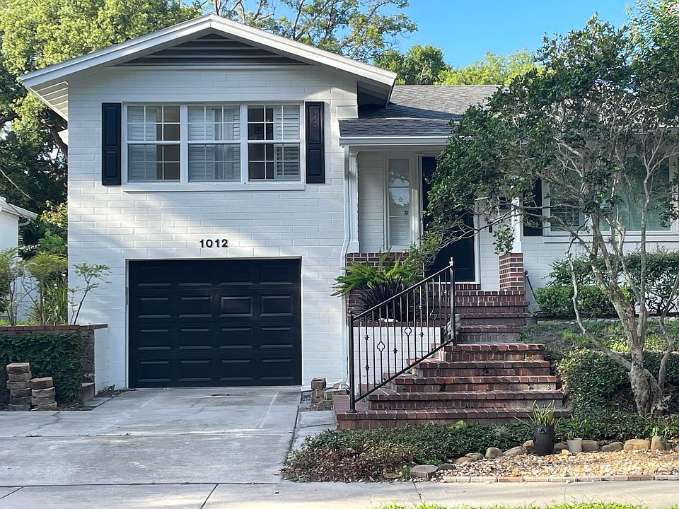 Split level home with garage and parking for two vehicles.