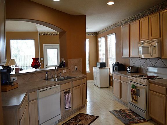 Open kitchen with plenty of counter and cabinet space.