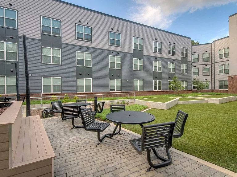 Second courtyard with dining and seating areas