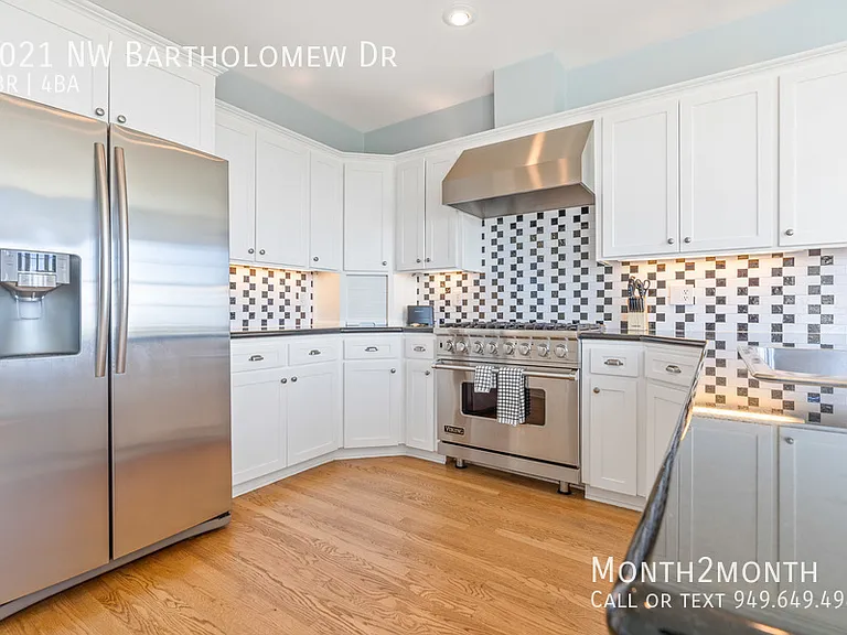 9021 NW Bartholomew Dr — Photo 26