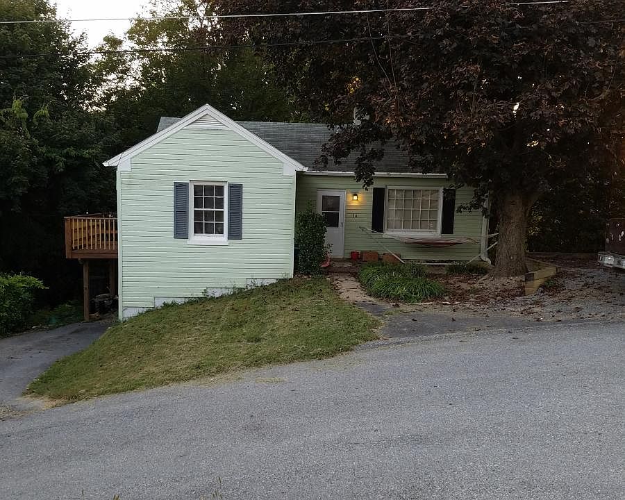 Front of house, shows deck off kitchen