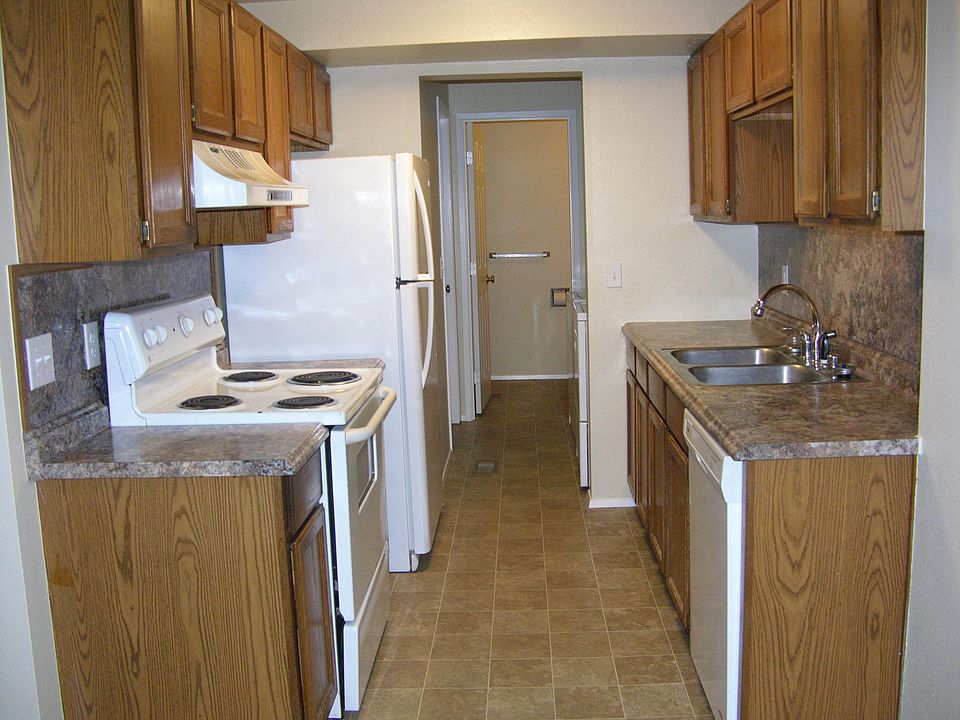 Kitchen, with laundry and half bath beyond.
