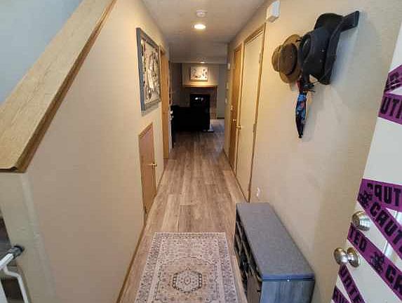 downstairs hallway, leading from the front door to the living room, kitchen and dining area