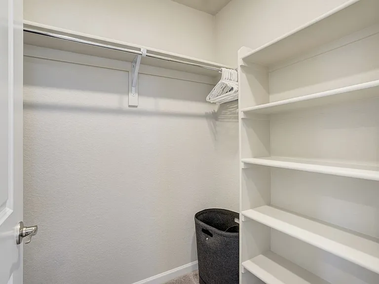 Master closet
Attached bath with dual vanities, walk-in shower and walk-in closet.