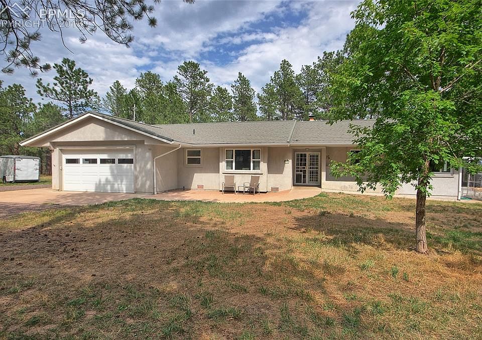 One-level stucco rancher on 5.75 treed acres in Black Forest
