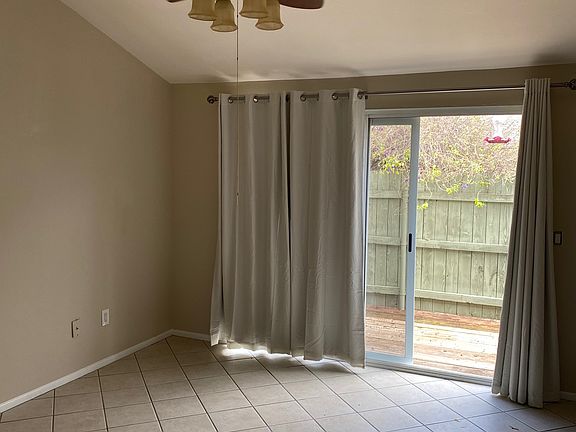 Master bedroom with sliding doors leading to back patio.