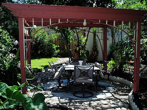 Pergola in the back perfect for dinner parties.
