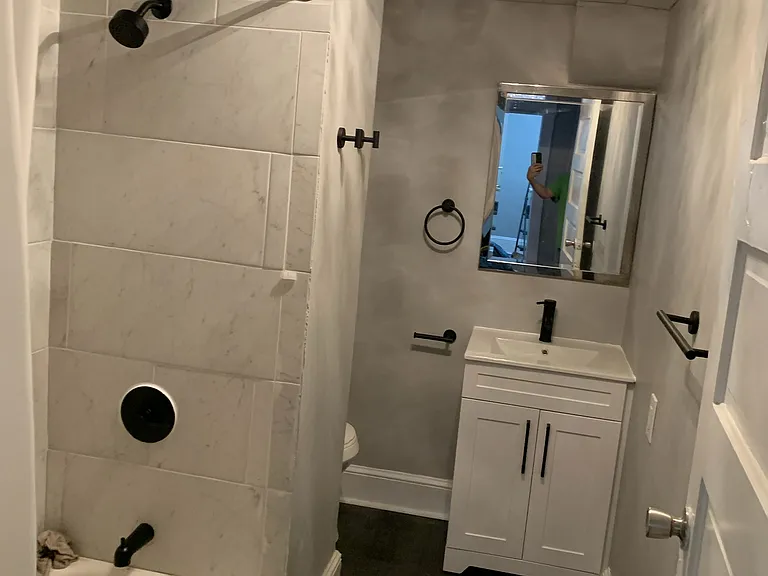 NEWLY RENOVATED BATHROOM! New Luxury Vinyl Tile (LVT), Vanity, Faucet, Hardware, Shower Set and Shower Rod!
