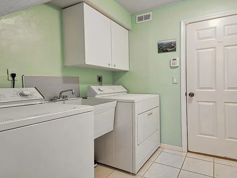 laundry room. washing machine. tumble dryer