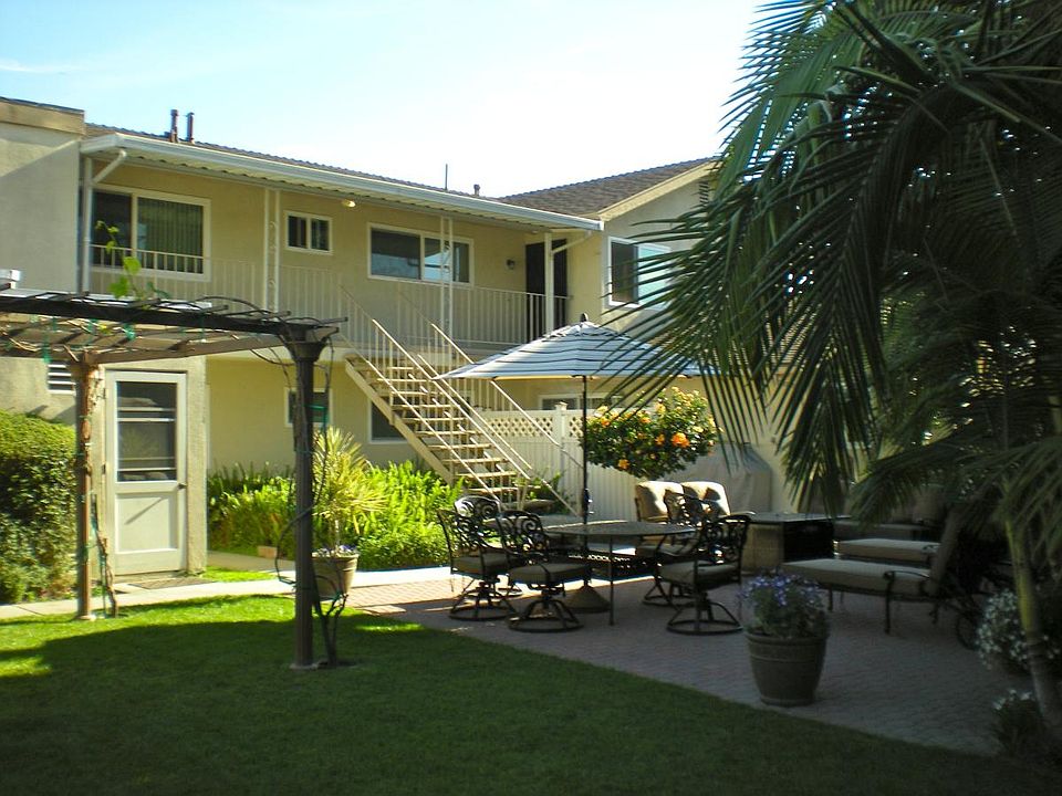 Backyard/patio view toward apts.
