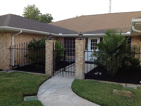 Private courtyard leads to front door of this unique home