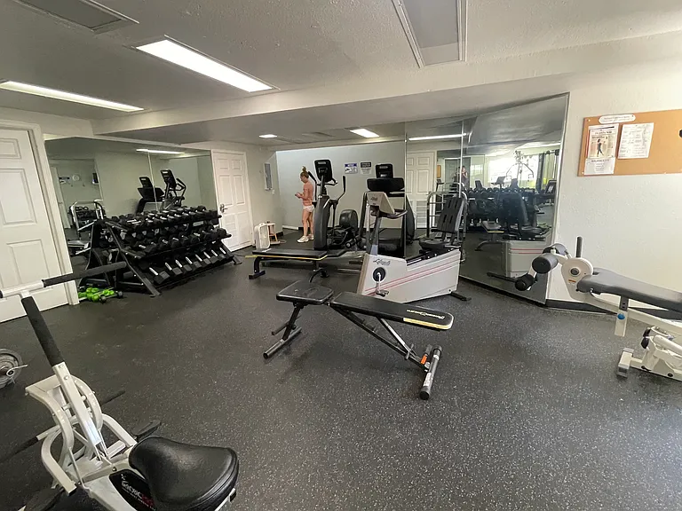 Newly remodeled exercise room in basement of clubhouse. Free to all residents to use. Has complete set of weights, machines, and showers.
