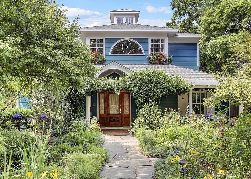 Beautiful home on extra large corner lot in close -in Bellaire. Covered front brick porch with swing