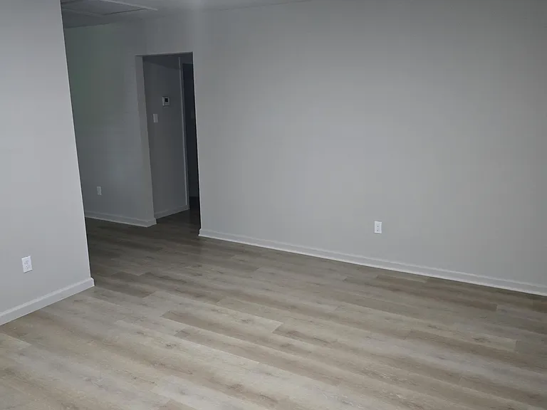 Living room view to hallway, new flooring, lighting, new HVAC