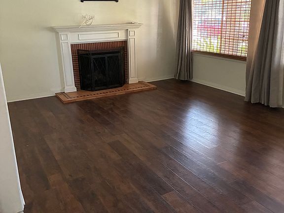 Living Room with fireplace and A/C unit