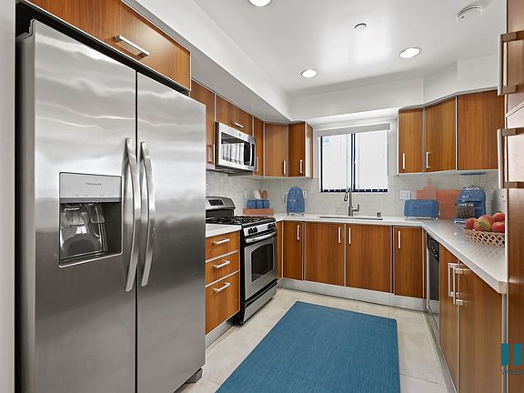 Kitchen with Energy-Efficient Refrigerator, Stove, Microwave Oven, and Dishwasher