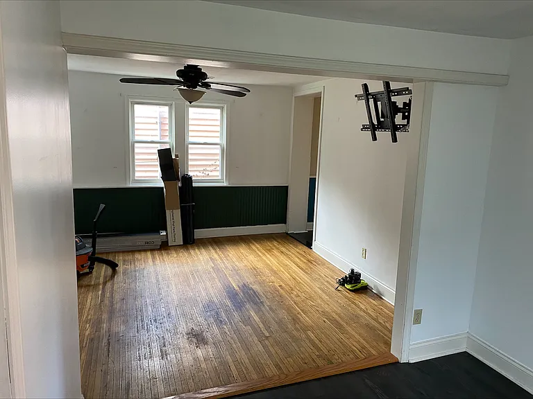 Living room with TV Wall Mount. Original Wood Floors