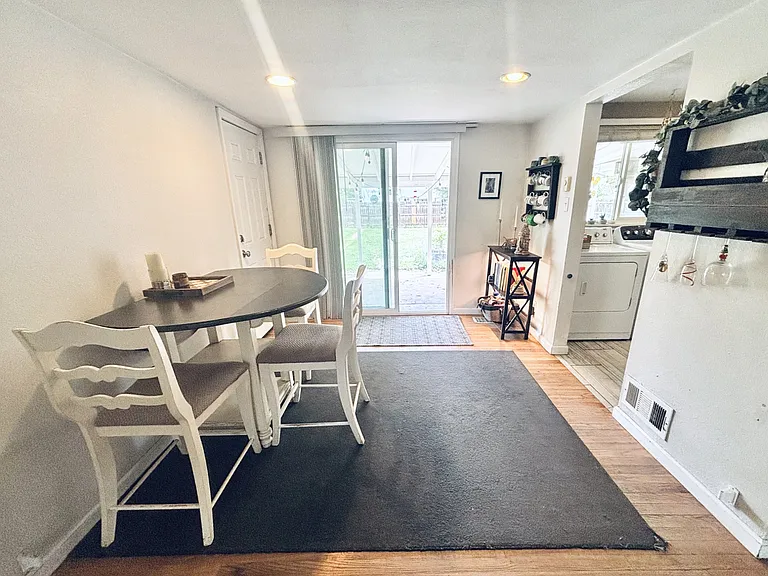 Dining area leading to sliding doors to covered patio