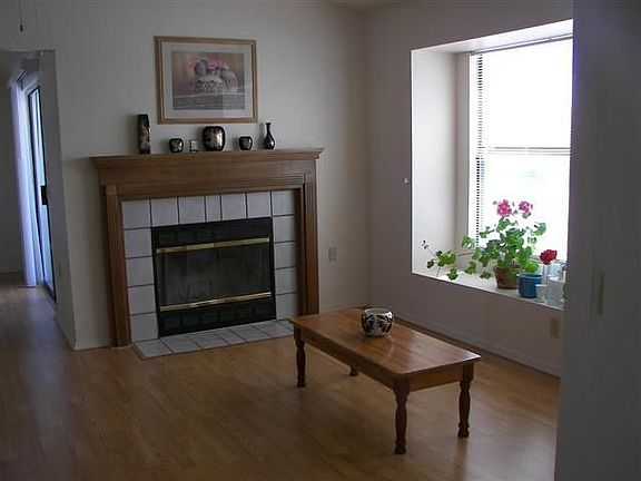 living rm with wood burning fireplace