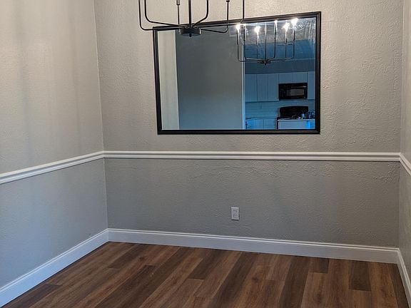 Freshly painted dining area with new chandelier