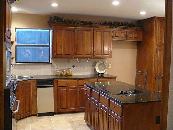 Remodeled Kitchen with new recessed lights, tile floors