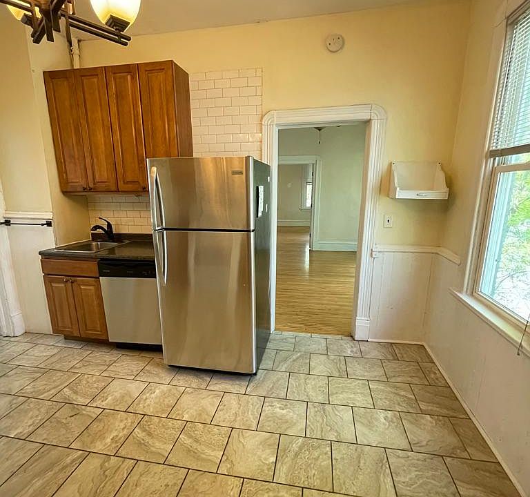 Kitchen area with dishwasher, gas range, great storage and plenty of space for a small table at the window area for dining.