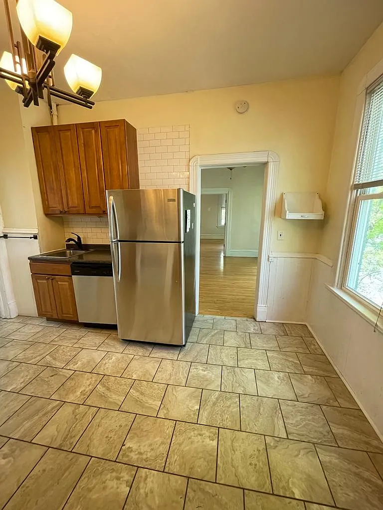 Kitchen area with dishwasher, gas range, great storage and plenty of space for a small table at the window area for dining. - 2019 27th Ave S #2