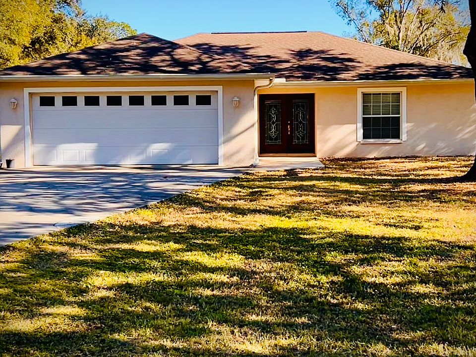 Front home exterior with extra large garage.