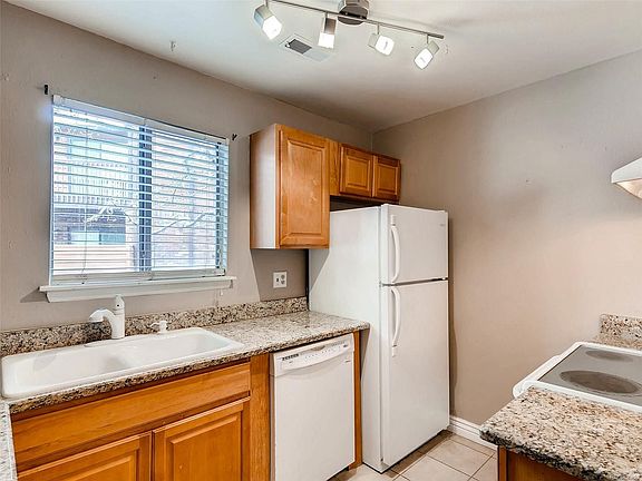 Granite countertops with courtyard view.