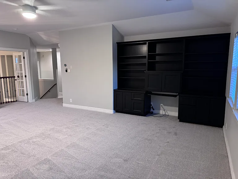 Large loft/game room with built in desk