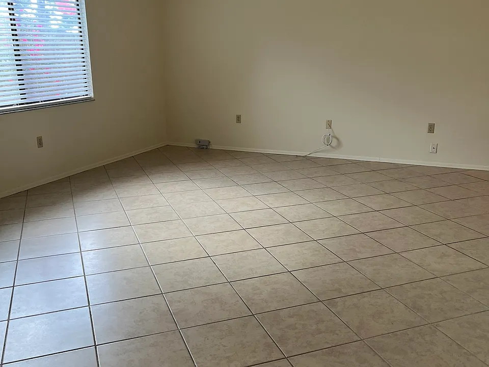 Living room area with vaulted ceiling and ceiling fan