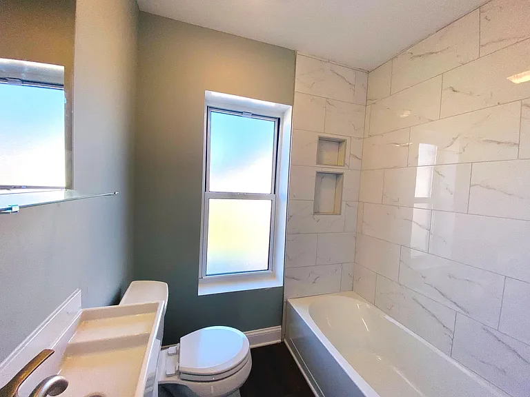 2nd floor Bathroom with large format porcelain tub tiles