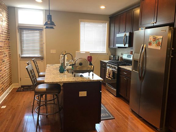 Kitchen with island and stainless steel appliances