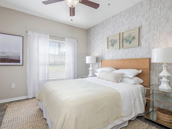 Step into the lap of luxury in our spacious master bedroom, graced with wood-style flooring and a majestic ceiling fan that's fit for royalty. Unwind in style and comfort.