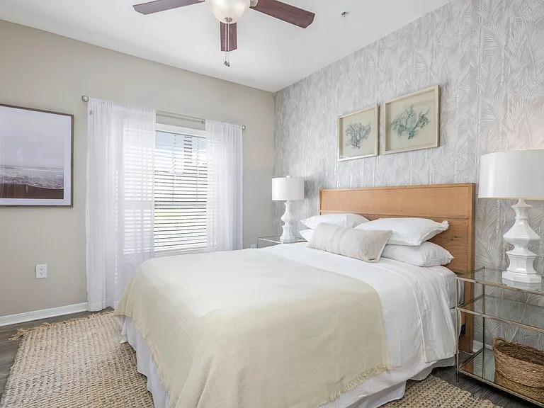 Step into the lap of luxury in our spacious master bedroom, graced with wood-style flooring and a majestic ceiling fan that's fit for royalty. Unwind in style and comfort.