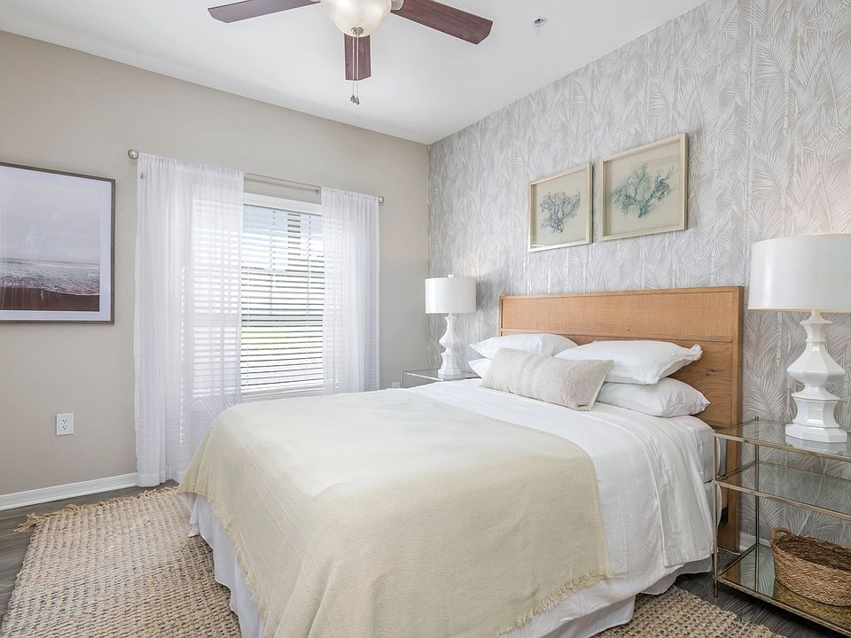 Step into the lap of luxury in our spacious master bedroom, graced with wood-style flooring and a majestic ceiling fan that's fit for royalty. Unwind in style and comfort.